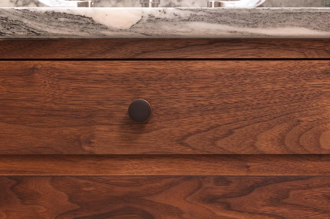 dark wood vanity with marble countertop