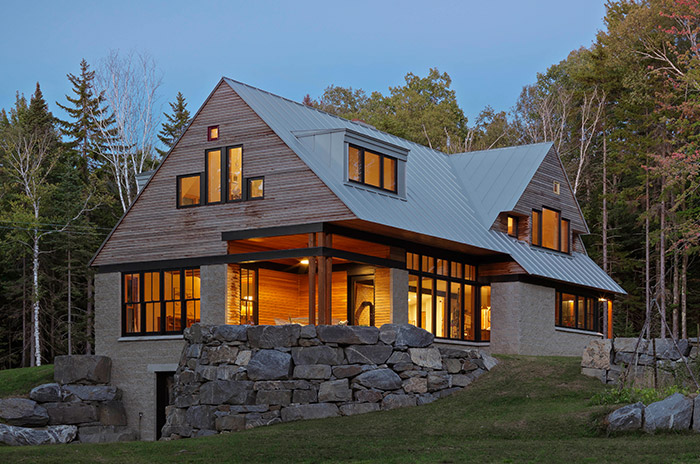 modern home with stone wall